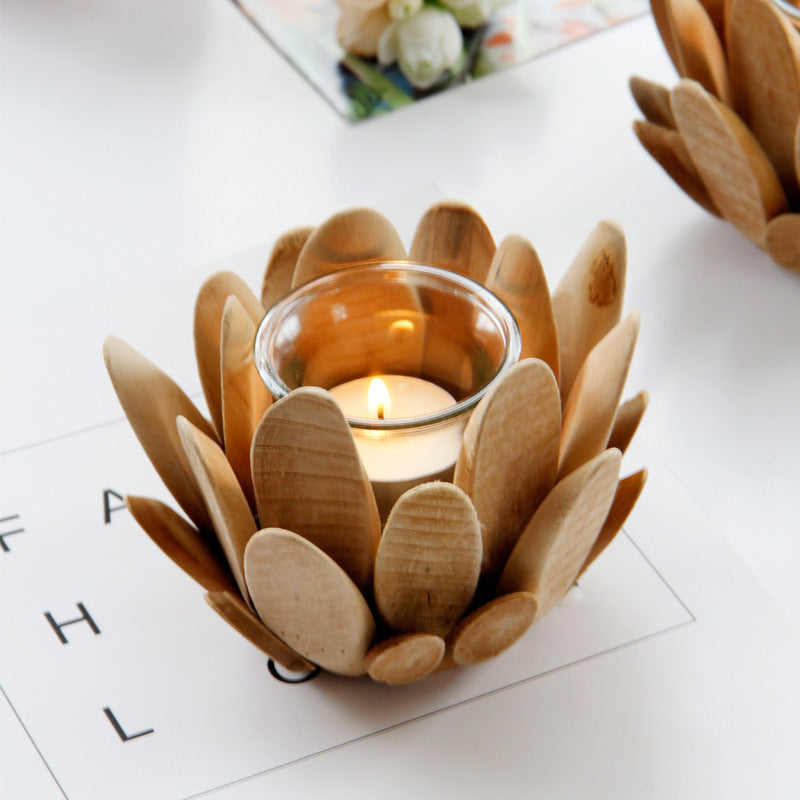 A Nordic style wooden candlestick holder with a minimalist design, displaying a candle inside. The holder is made of natural wood with a smooth finish.